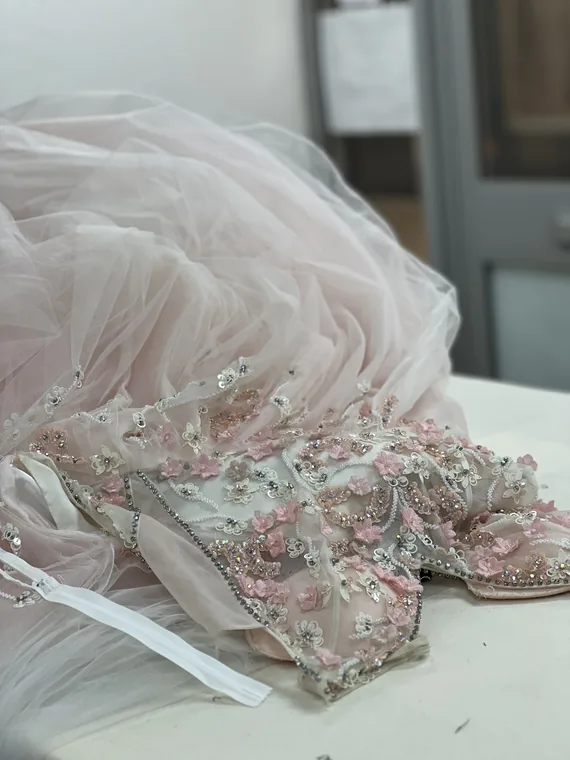 Close detail of blush beaded tulle