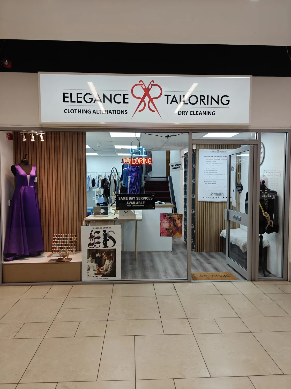 The Elegance Tailoring shopfront and illuminated sign on St Peter's Way